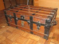 Front and top view of the trunk showing metal reinforcements and latch detail