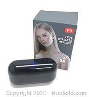 Closed black charging case with a clear top showing earbuds inside and the F9 True Wireless Headset box behind it.