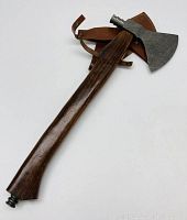 Full view of axe head, handle and detached leather sheath on white background