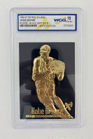 Front view of the 1996-97 Skybox EX-2000 Kobe Bryant rookie card with gold embossing, graded 10 GEM-MT by WCG in a hard plastic case.