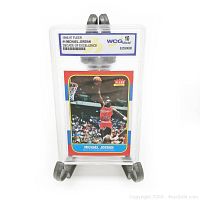 Front view of encapsulated card on easel showing full card and grading label