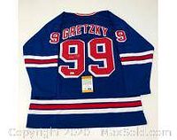 Full back view of blue Rangers jersey showing name, number and authentication sticker at hem