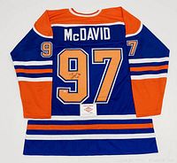 Back view of jersey showing McDAVID name, 97 numbers, signature and PAAS COA card