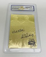 Front of the 23KT gold Babe Ruth / Lou Gehrig baseball card showing embossed player images, signatures, and grading label.