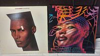 Front covers of two Grace Jones vinyl albums: "Living My Life" with a white cover and stylized portrait, "Inside Story" with a colorful graphic cover.