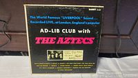 Front cover of the vinyl album titled 'Ad-Lib Club with The Aztecs,' showing the band name, live recording location London, and 'Liverpool Sound' branding.