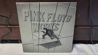 Front cover of the Pink Floyd Works vinyl album showing embossed large text and surreal artwork.