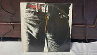 Front cover of the Sticky Fingers album showing jeans with yellow zipper.