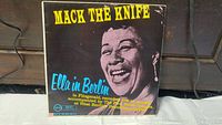 Front cover of the Ella Fitzgerald album 'Ella in Berlin: Mack the Knife' with large photo of Ella Fitzgerald and title text.