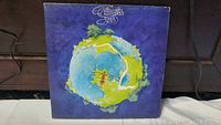 Front cover of Yes Fragile album showing globe artwork.