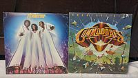 Front covers of Shalamar and Commodores vinyl albums showing artwork and band images.
