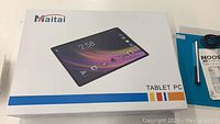 Closed Maitai Tablet PC retail box showing front image and brand.