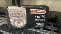 Box of EleMake mechanical keypad deadbolt, showing brand, model, and 100% mechanical with SS304 stainless steel build