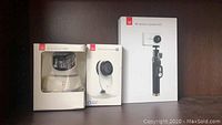 YI dome security camera, home camera, and 4K action camera kit boxed and displayed together