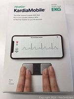 Front of the product box showing the AliveCor KardiaMobile unit and smartphone with EKG graph on screen.