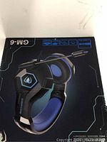 Boxed Beexcellent GM-6 gaming headset showing branding and features on packaging