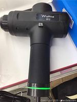Wattne W2 handheld percussion massage gun black color showing side view with brand label.
