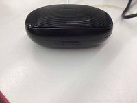 Closed black charging case with ribbed top for Atsound-T2 earbuds