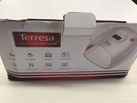 Terresa UV LED nail lamp box with branding and feature icons for infrared sensor, LCD display, 3 timer settings, and long-lasting LED lights.