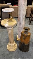 Photo shows all three items: ceramic pedestal, metal vessel, and dolphin base with marble top.
