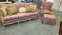 Photo showing full lavender damask sofa with 5 decorative pillows, gold-painted carved wood legs and trim.