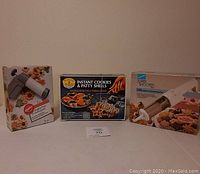 Three boxed new cookie making devices: Wilton Cookie Press, Super Shooter, Double Rosette & Timbale Iron