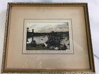 Framed photograph showing the overall piece with visible wear on frame edges.