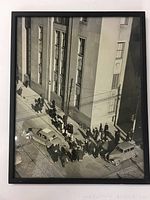 Full view of framed black and white vintage photograph showing City of Toronto Public Works building and street scene with pedestrians and cars from above.