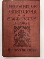 Front cover of book 'Decorative Brush-Work and Elementary Design' by Henry Cadness showing title and decorative elements in black on reddish-brown cloth binding.