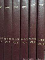 Spine view of maroon cloth bindings showing gold-stamped titles for volumes 5–9