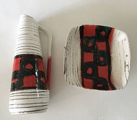 Top view of pitcher and matching rectangular dish showing geometric design and colors