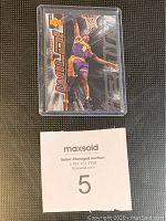 Photo of Kobe Bryant Upper Deck SP Wild basketball card in protective case showing front of card with colorful design and action image.