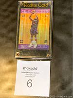 Front view of Vince Carter Upper Deck Encore Future Watch Rookie basketball card in plastic protective holder showing player in shooting pose with colorful design.