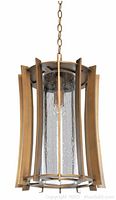 Assembled lantern showing bronze dusk finish aluminum frame and clear seeded glass shade suspended by chain.