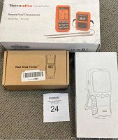 Boxed ThermoPro TP20S remote food thermometer, Preciva TH240 wall stud finder brown box, and Vson air detector box with product drawing.