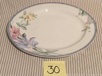 Oval ceramic serving plate with Classic Garden floral pattern, showing full top surface design and condition, placed on cloth background with lot number 30.