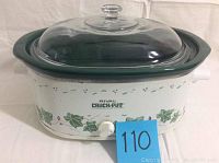 Front view of the Rival Crock-Pot slow cooker showing the green ivy design, control knob, and clear glass lid.