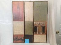 Front view of three tall narrow framed Venice themed art panels side by side showing muted color images of Venetian architecture and gondolas.