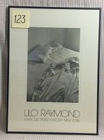 Framed black and white poster of unmade bed by Lilo Raymond with a small label '123' on the upper left corner of the frame.