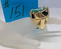 Photo of the ring on a display hand showing geometric design, mixed dark and clear crystals and rhodium plating.