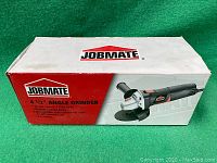 Box showing Jobmate 4 1/2 inch angle grinder image, branding, and specifications.