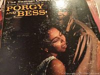Front cover of The Samuel Goldwyn Porgy and Bess LP showing two people in an embrace, dark background