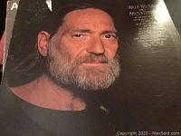 Close-up photo of a vintage LP album cover featuring Willie Nelson with a beard and Kristofferson