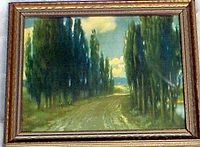 Framed vintage photo of tree-lined dirt road with gold textured frame