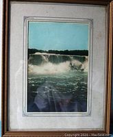 Full view of the framed waterfall photo showing the entire image, matting and frame.