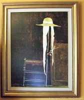 Front view of framed poster showing artwork of hat with ribbons and chair detail