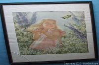 Framed painting showing young girl reaching for butterfly amidst greenery, signed by Frances Hook, fabric medium.