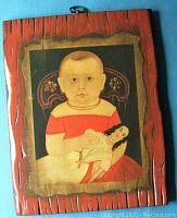 Full view of folk art painting of baby with doll on wood panel with decorative frame effect.