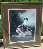Framed offset lithograph depicting two whippets in a dark wooded scene, triple matted and behind glass.