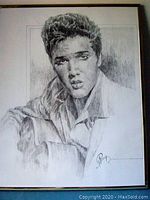 Full view of the framed pencil or ink drawing of young Elvis Presley by artist Robert Stephen Simon (Petronela).
